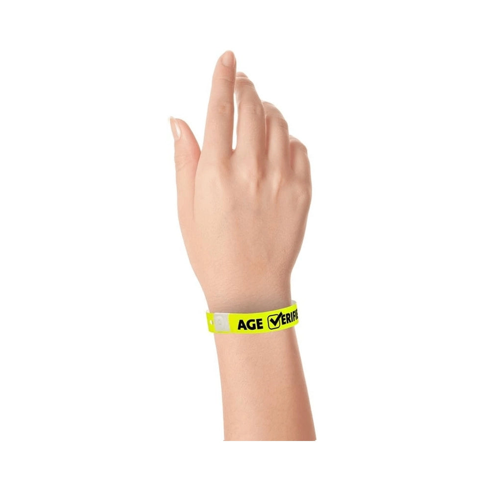 Plastic age verified wristband in neon yellow with text "AGE √ERIFIED" in black printed on the band - shown on wrist