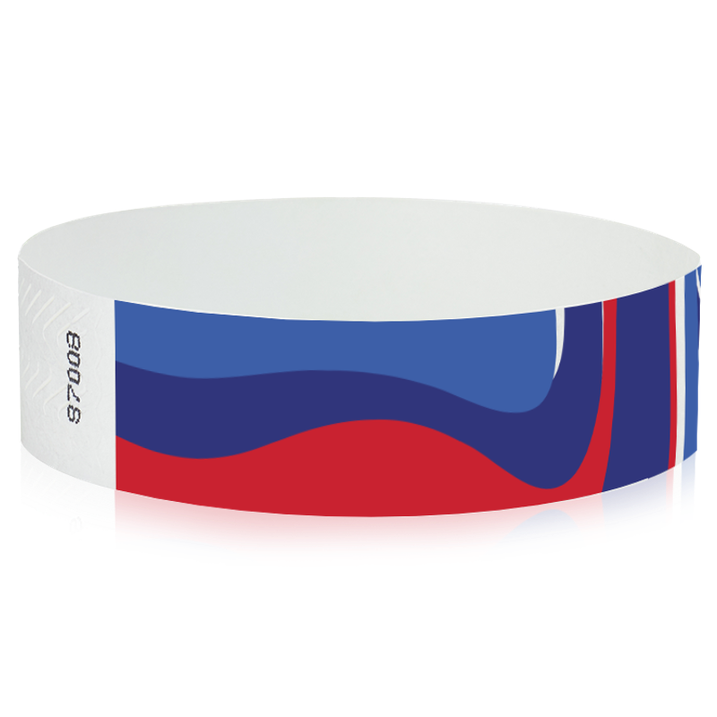 abstract pattern in neon blue, marine blue, neon red and white on a tyvek wristband - round version shown