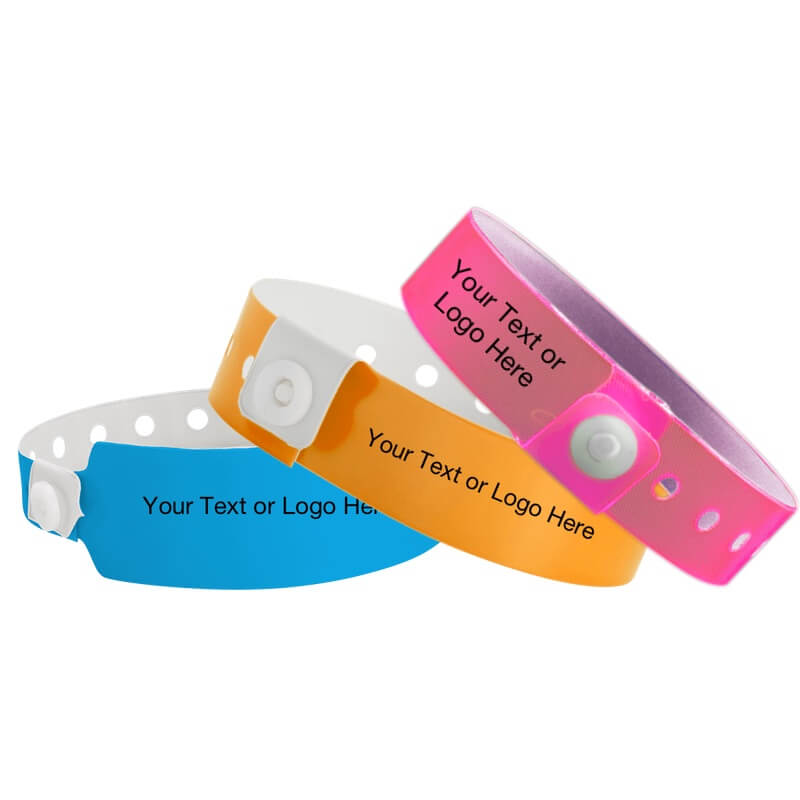 custom vinyl wristbands - shown in neon blue wide face vinyl, regular neon orange vinyl and edge glow neon pink vinyl