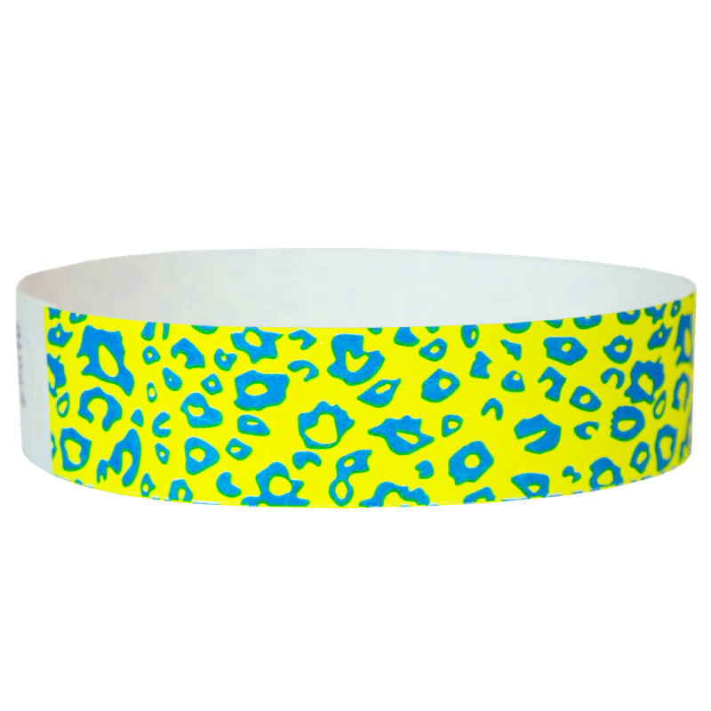  neon blue cheetah pattern on a neon yellow tyvek wristband - round version shown