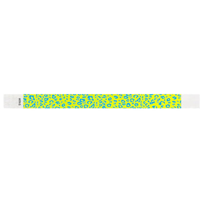 neon yellow tyvek wristband with neon blue cheetah pattern - flat version shown