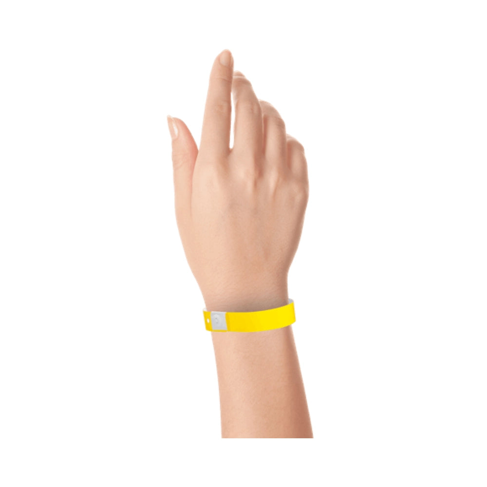 Plastic slim wristband in pantone yellow - shown on wrist