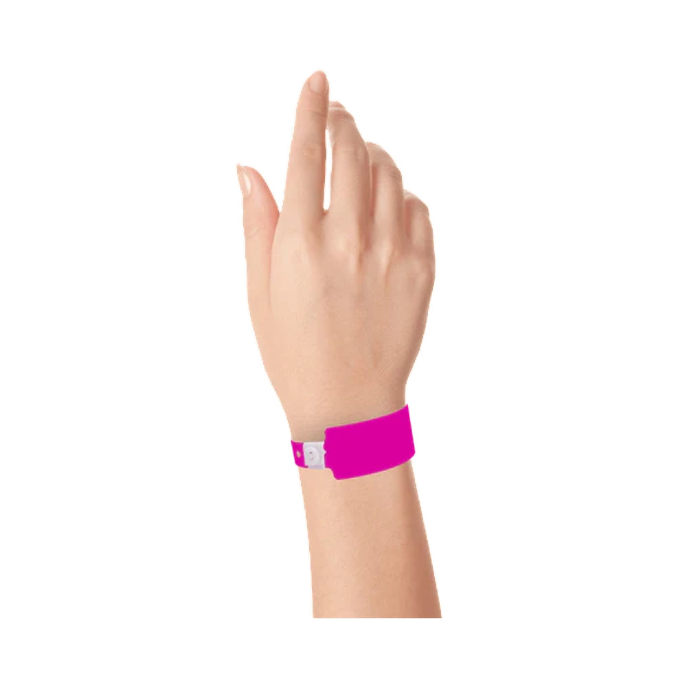Wrist wearing plastic wide face wristband in neon pink 