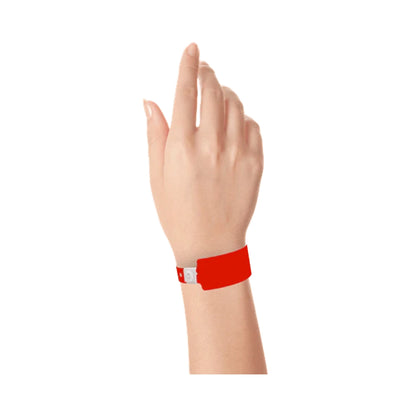 Wrist wearing plastic wide face wristband in neon red 