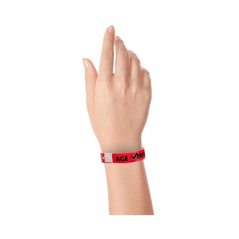 Plastic age verified wristband in neon red with text "AGE √ERIFIED" in black printed on the band - shown on wrist 