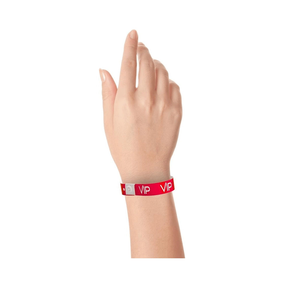 red plastic wristband with text "VIP" printed in white across the wristband - shown on wrist 