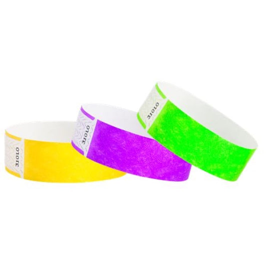 pantone yellow, pantone purple and neon green qwik fit tyvek wristbands - the adhesive is thinner to ensure easy application