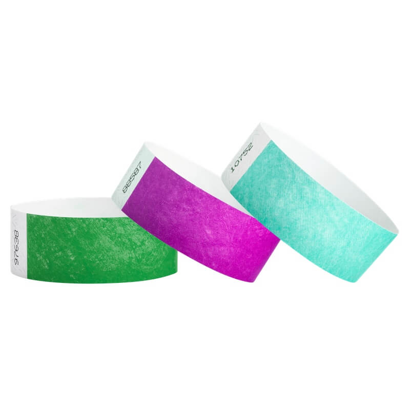 tyvek 1" solid wristbands shown in kelly green, pantone purple and aqua