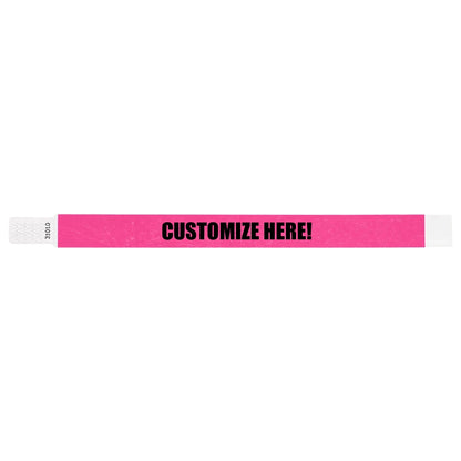 Neon pink tyvek qwik fit wristband with text "CUSTOMIZE HERE!" in black - shown in flat 