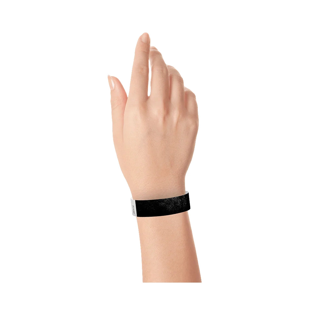 Black tyvek wristband on wrist 