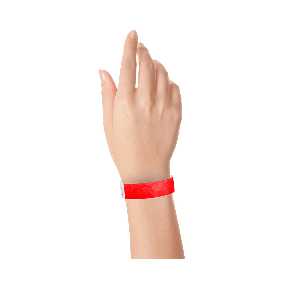 Neon Red tyvek wristband on wrist 