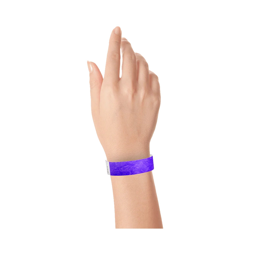 Purple tyvek wristband on wrist 