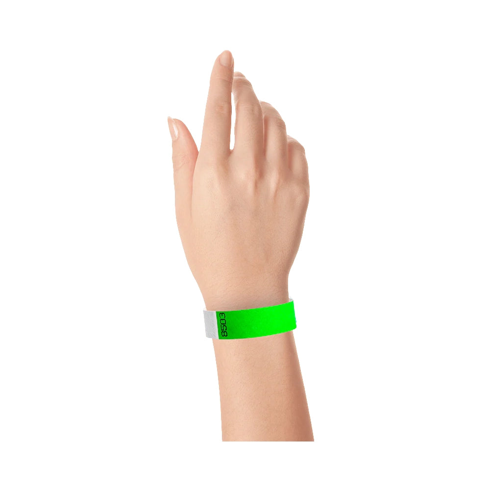 Wrist wearing tyvek duplicate number wristband in neon green 