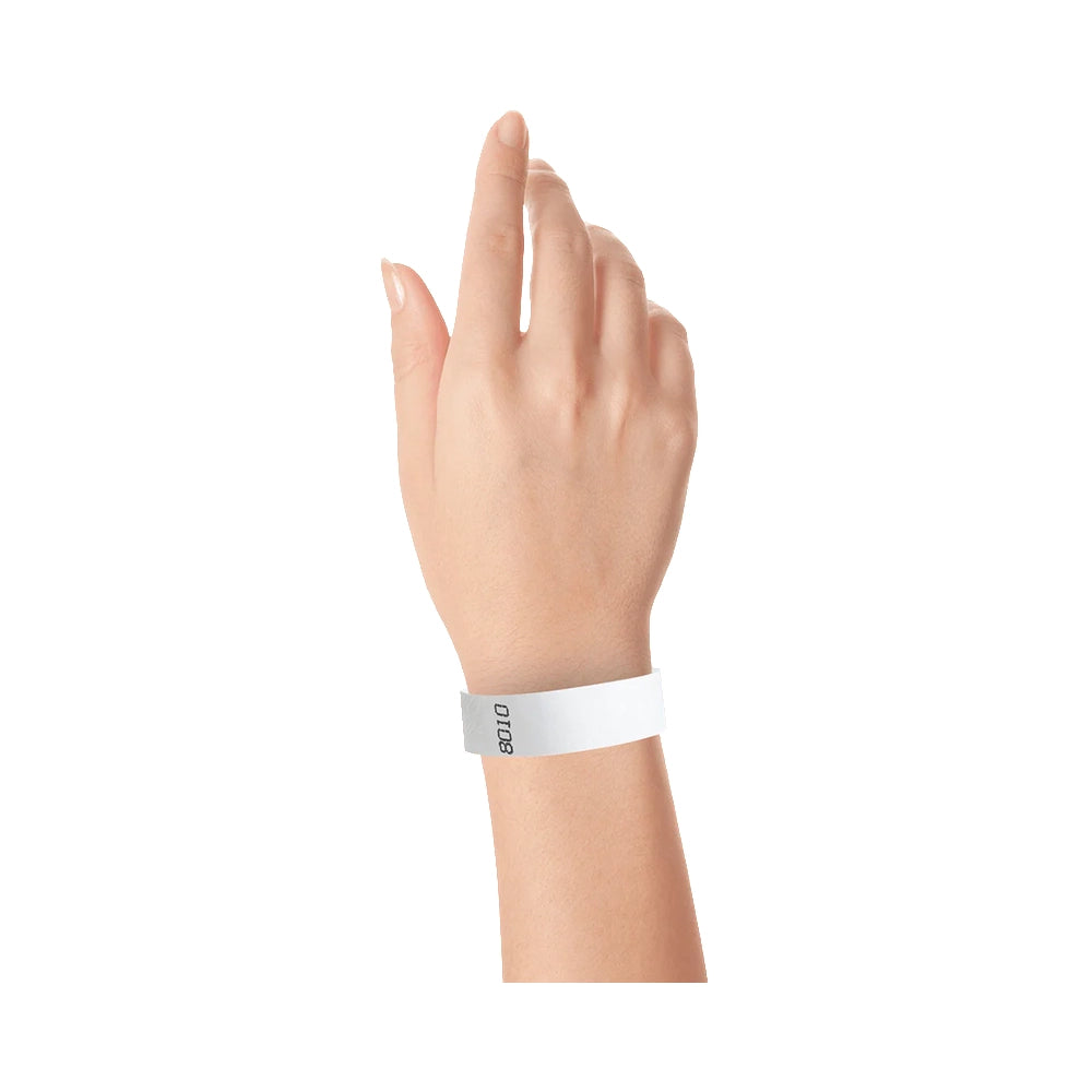 Hand wearing duplicate number in purple tyvek 3/4" wristbands 