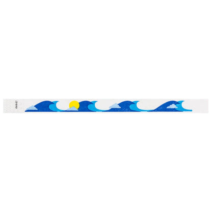 White tyvek wristband with blue wave and yellow sun design - flat version shown