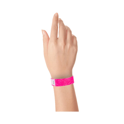 Wrist wearing neon pink qwik fit wristband 
