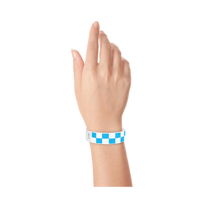 Hand wearing a neon blue and white checkered wristband 