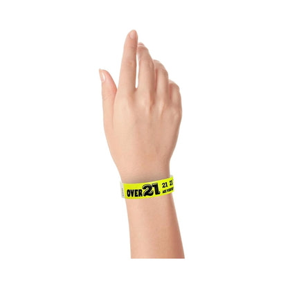 Wrist wearing Wristband with text "Over 21" in neon yellow