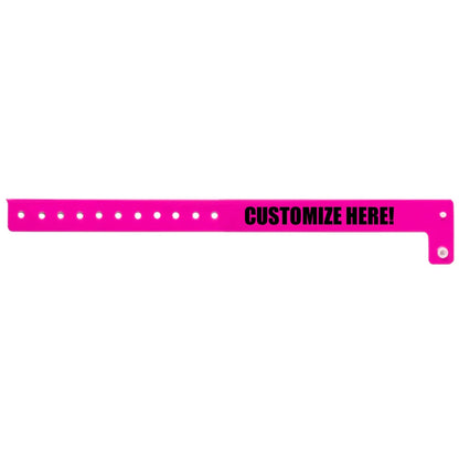 vinyl regular wristband in neon pink with black text "CUSTOMIZE HERE!" - shown in flat nk