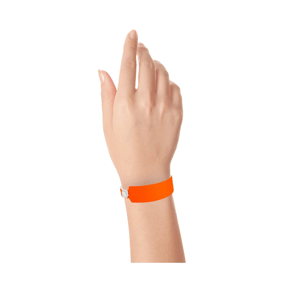 vinyl wide face wristband in neon orange - shown on wrist 