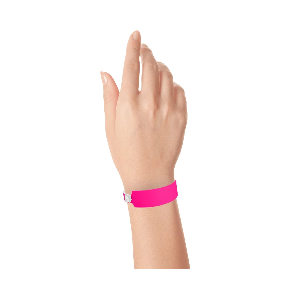 vinyl wide face wristband in neon pink - shown on wrist