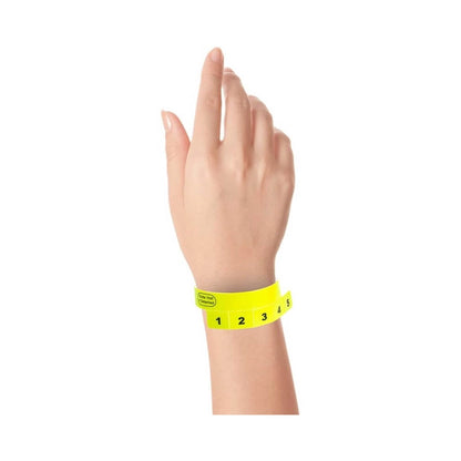 vinyl wristband with 5 tabs in neon yellow - shown on wrist