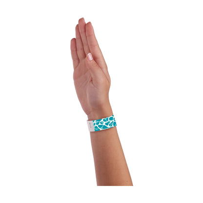 wrist wearing white tyvek wristband with swimming pool pattern in aqua 