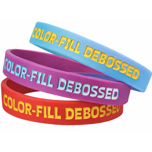 color-filled debossed wristbands shown in red (yellow fill), purple (blue fill) and sky blue (yellow fill)