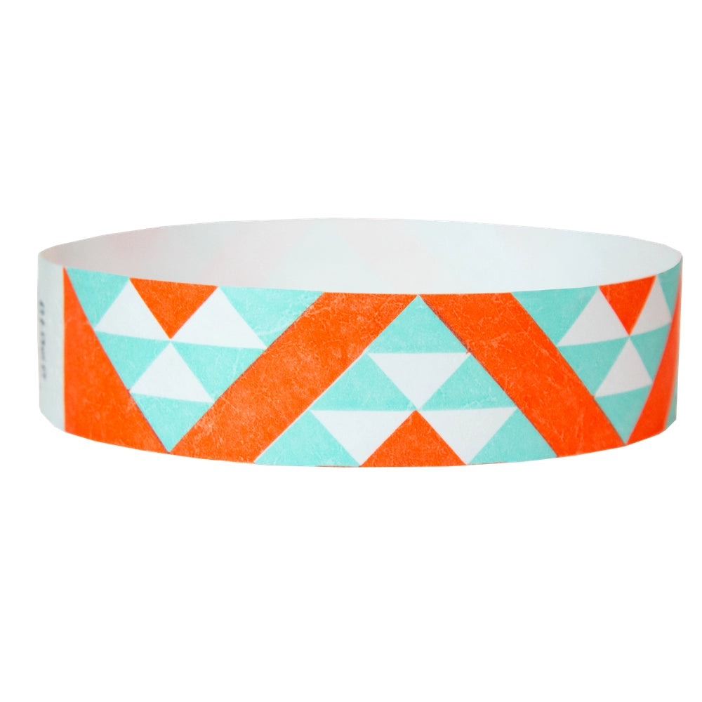 aqua and neon orange aztec pattern on a white tyvek wristband - round version shown