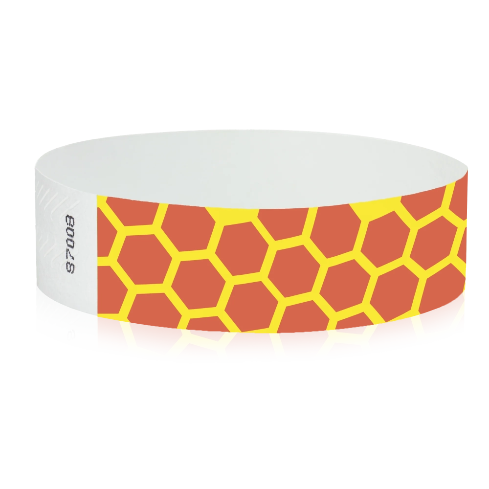 orange tyvek wristband with neon yellow honeycomb pattern - round version shown