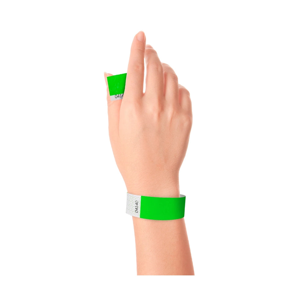Wrist wearing Tyvek 1" stub wristband in neon green 