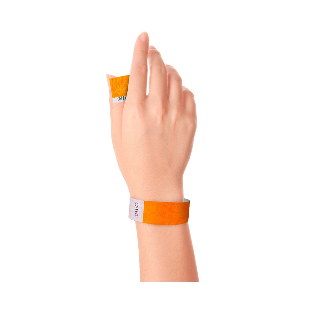 Wrist wearing Tyvek 1" stub wristband in neon orange