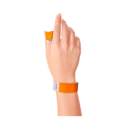 Wrist wearing Tyvek 1" stub wristband in neon orange