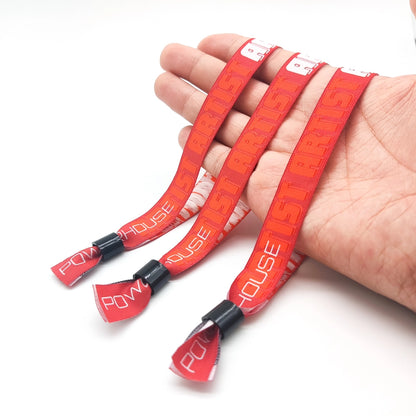 red woven wristbands on hand