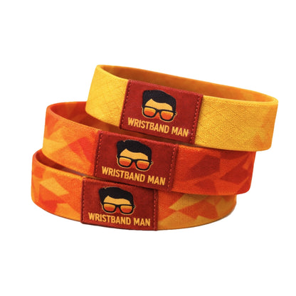 elastic fabric wristbands in orange/ red/yellow with the wristband man logo